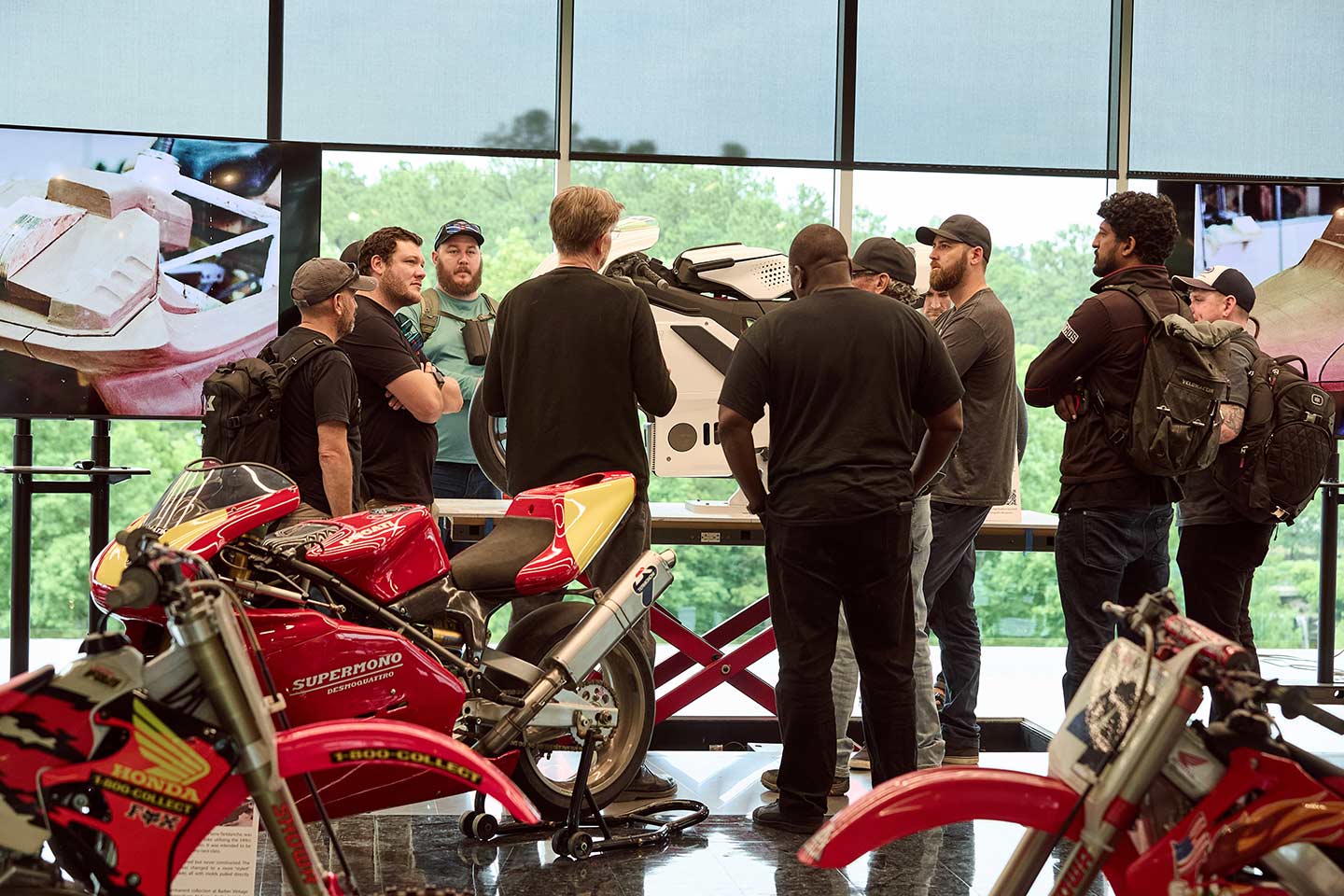 A highlight from our trip to the Barber Motorsports Museum was spending 30 minutes talking with legendary motorcycle designer Pierre Terblanche (center), who now works out of the Barber Advanced Design Center (BADC). Behind Terblanche is the Ducati Supermono he famously brought to life. On the lift just in front of him is the “motorcycle of the future” concept he’s designed, which is modeled entirely (save for its wheel rims) by 3D printing.