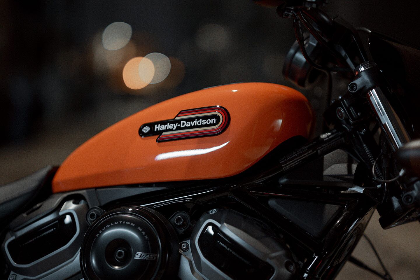 The Nightster’s “gas tank” is actually an airbox cover. The real fuel cell extends from beneath the seat to below the swingarm.