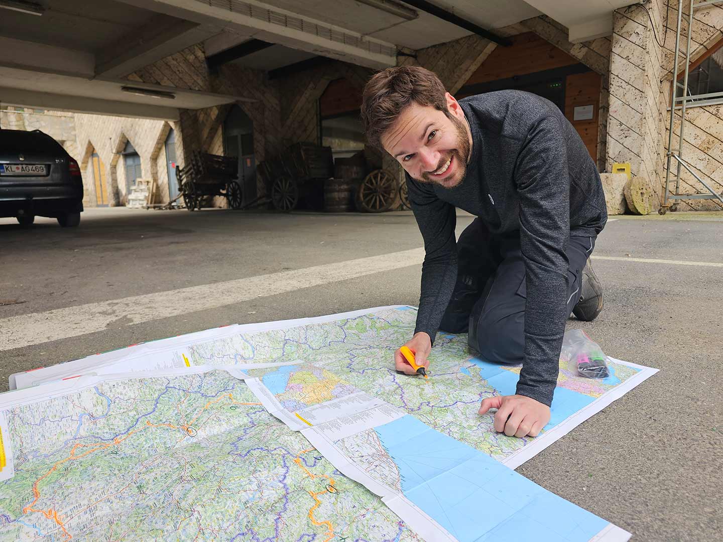 The author, looking forward to the day’s ride, marks the route on the map.