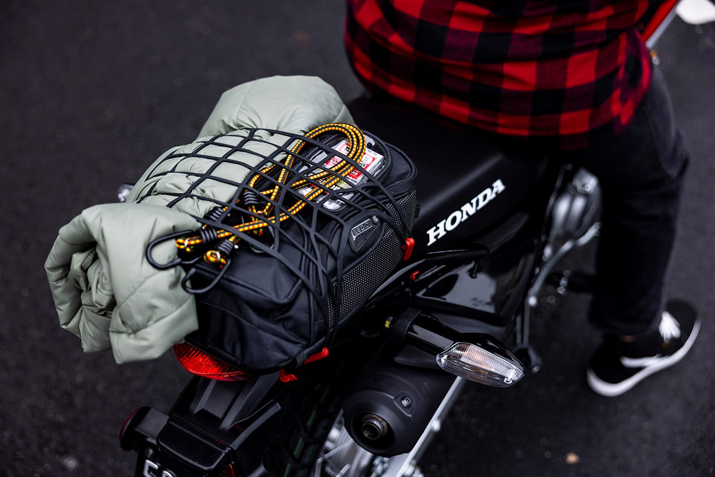Between the standard rear rack and Honda’s accessory throw-over saddlebags, the XR150L is ready for adventure.