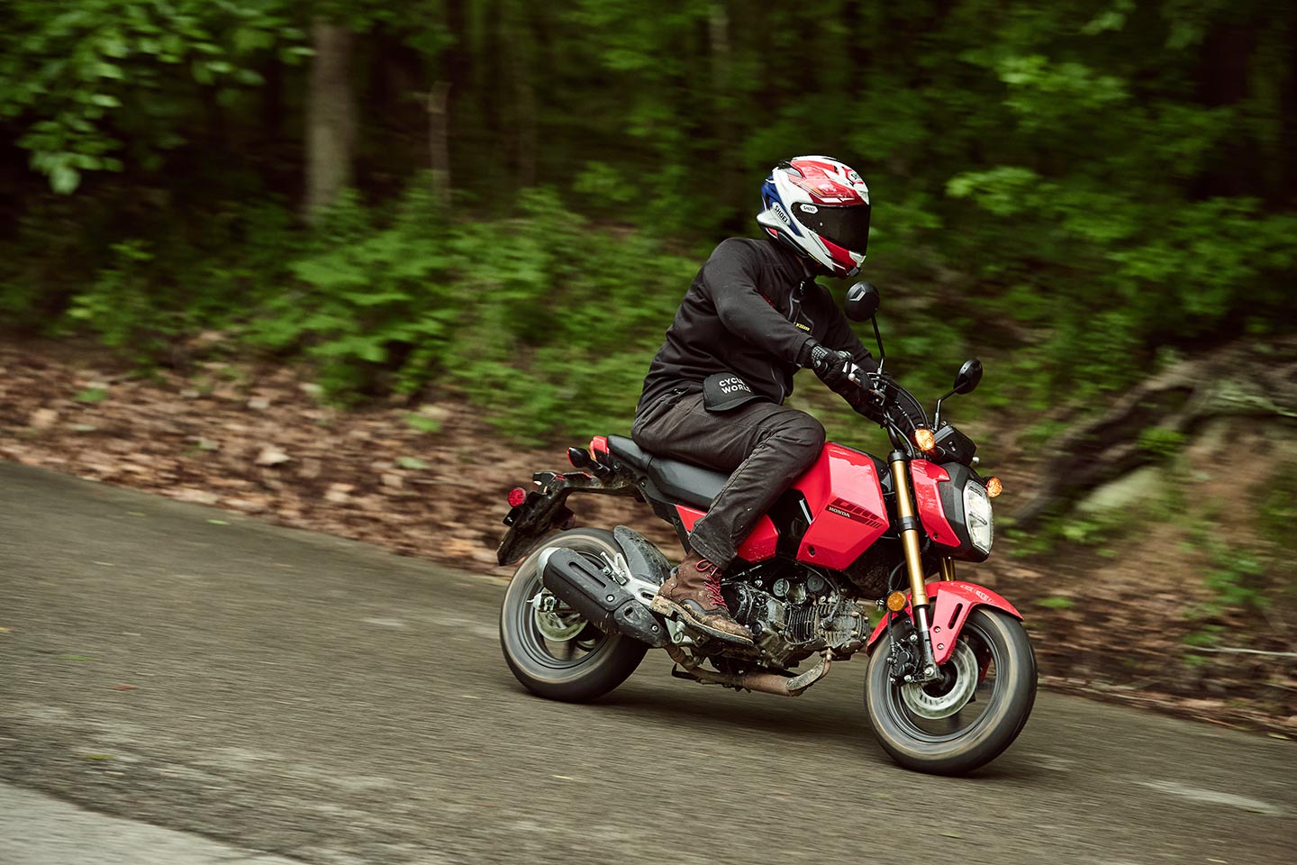 The Grom’s rider triangle is surprisingly accommodating for taller riders, even if it means sitting way back in the flat seat that Honda transitioned to for the 2022 model year.