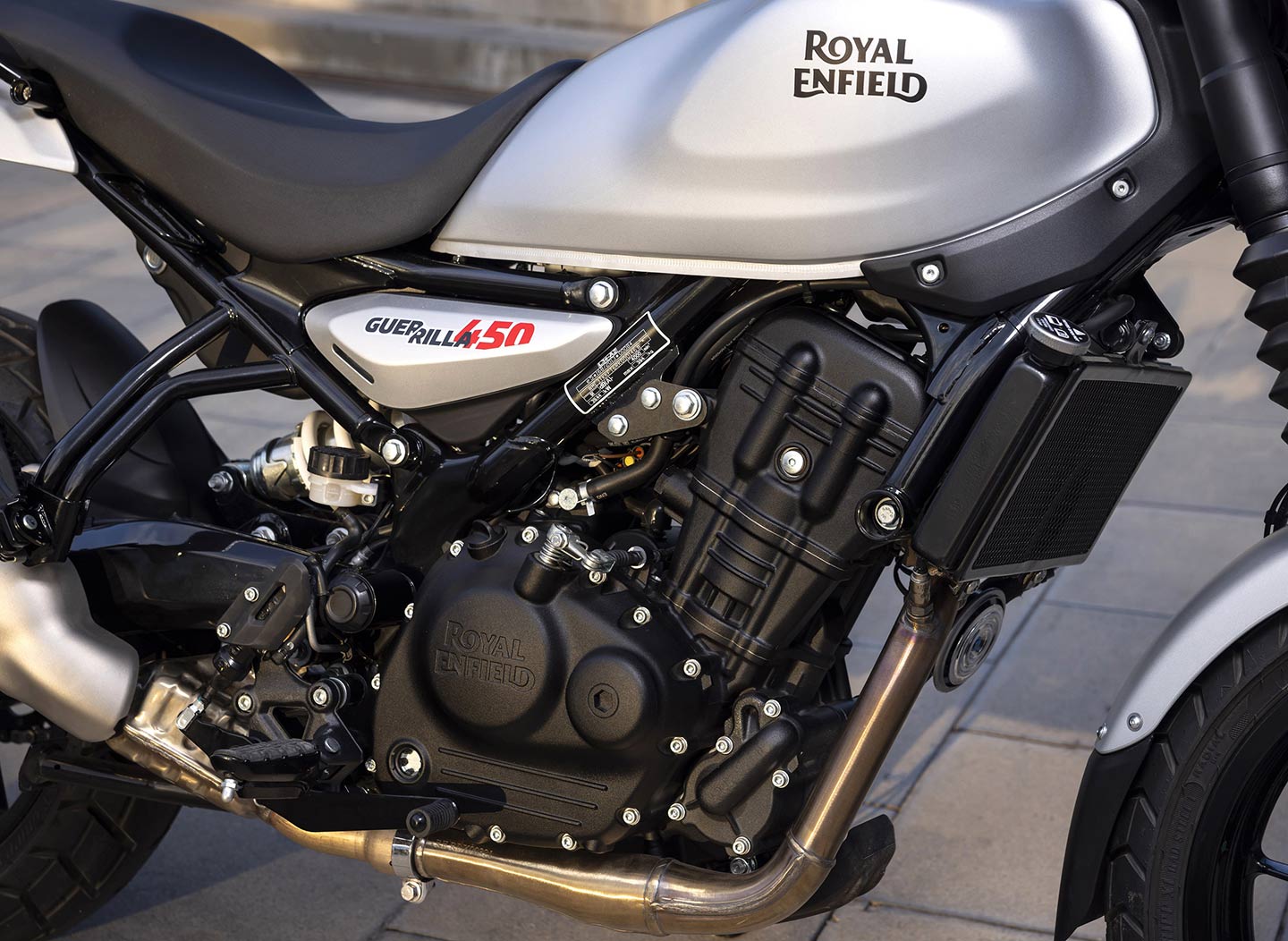 The bike’s Sherpa engine is virtually unchanged in this application, producing almost identical horsepower and torque as the Himalayan. Redesigned tank holds 2.9 gallons.