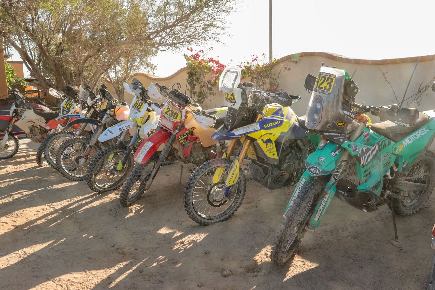 One of these things is not like the other… Bike tucked in for the night at impound.