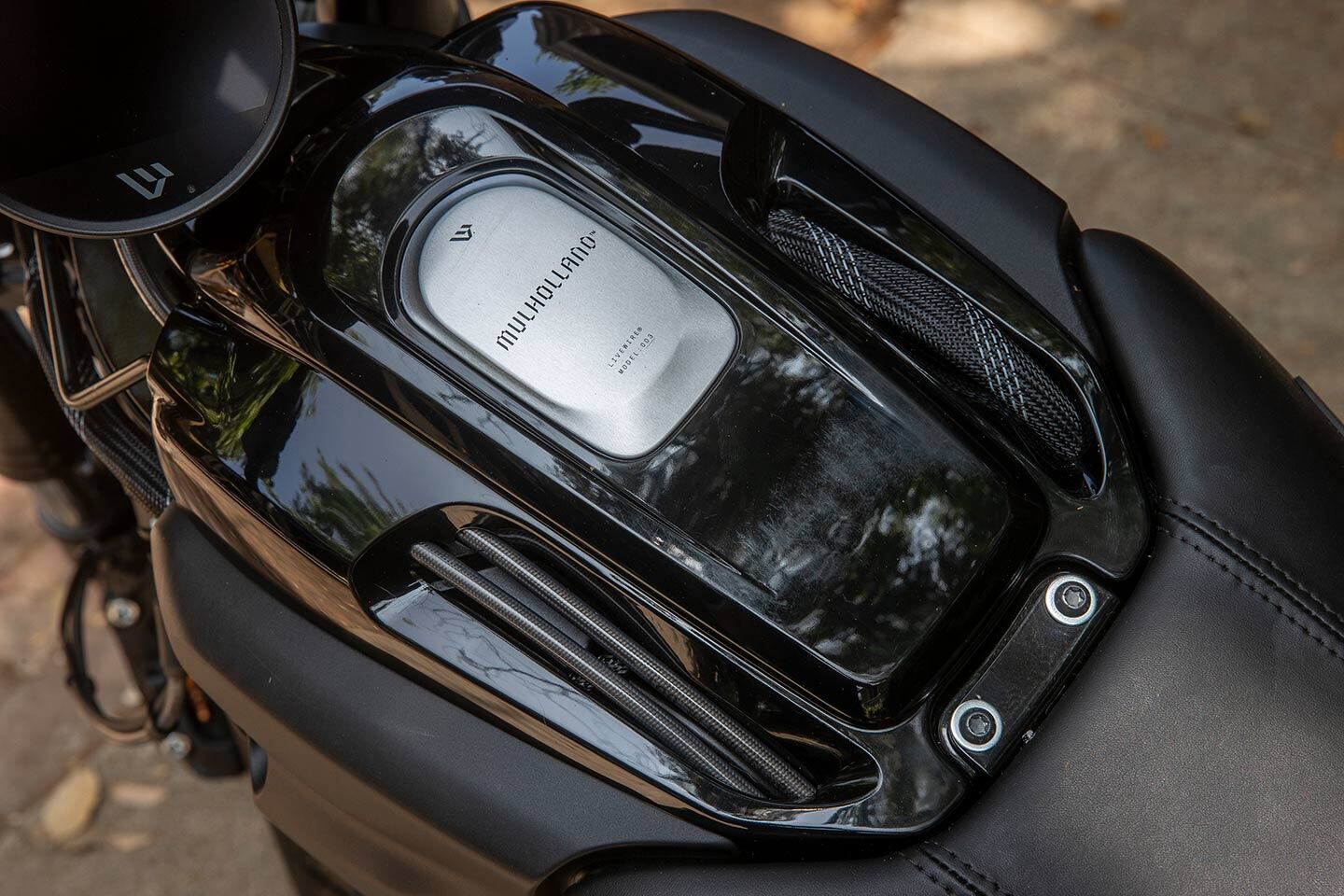 Exposed cables and wiring replace the faux gas tank aesthetic we see on many electric motorcycles, like the S2 Del Mar from LiveWire.