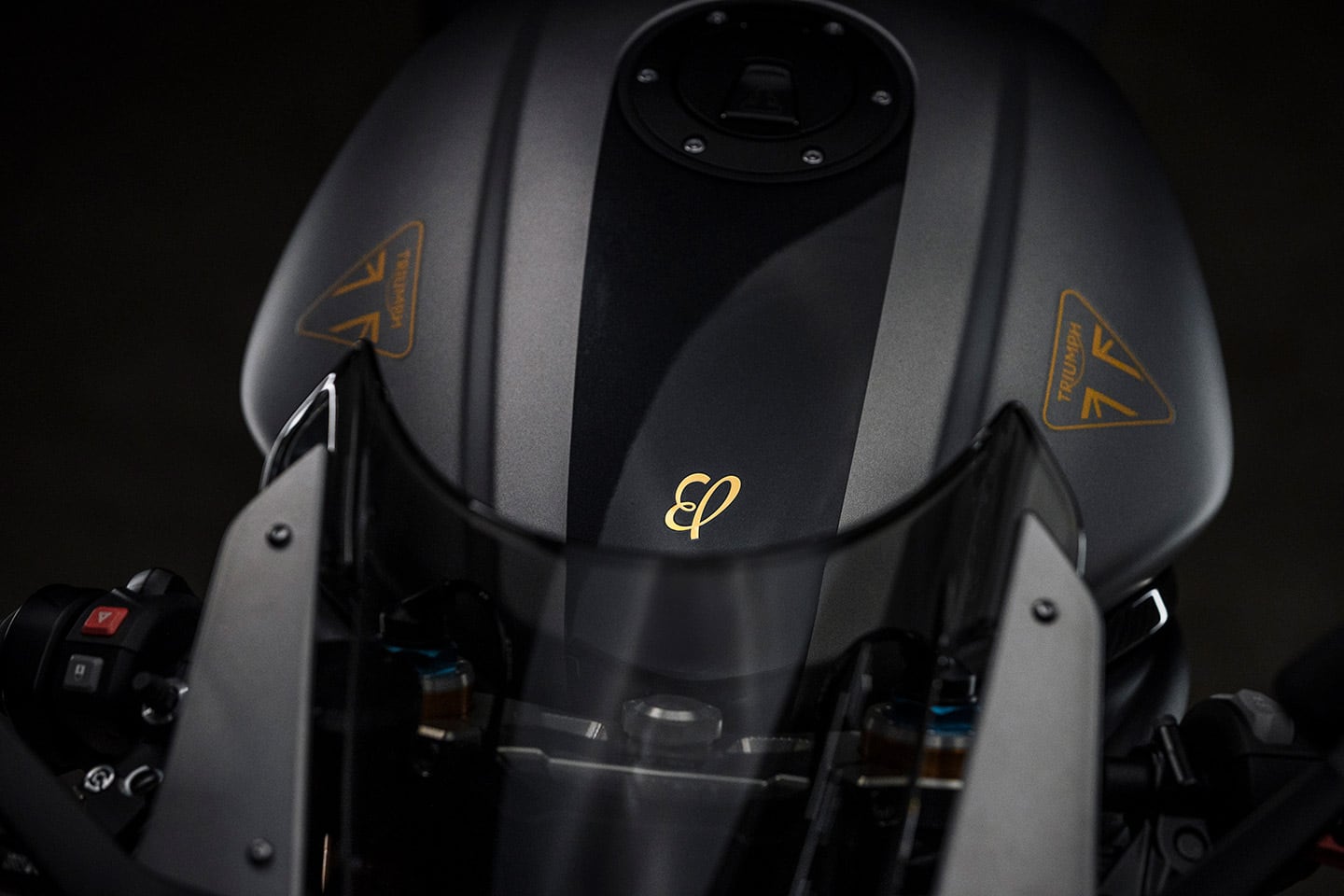 The tank features a gold Breitling badge.