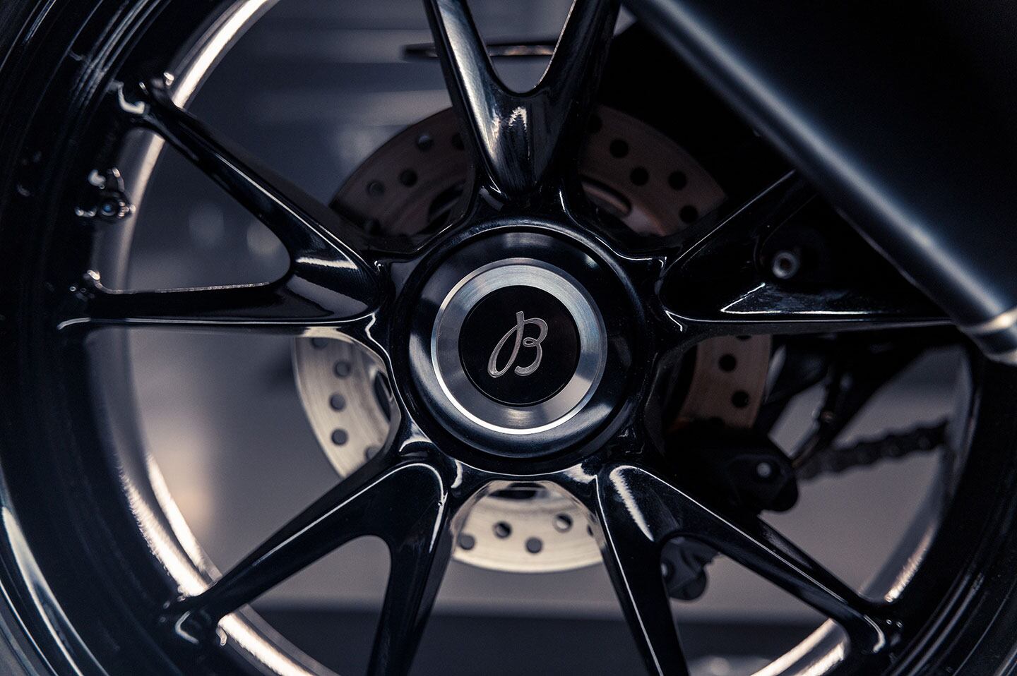 The rear wheel features a laser-etched Breitling logo on the hub cover.