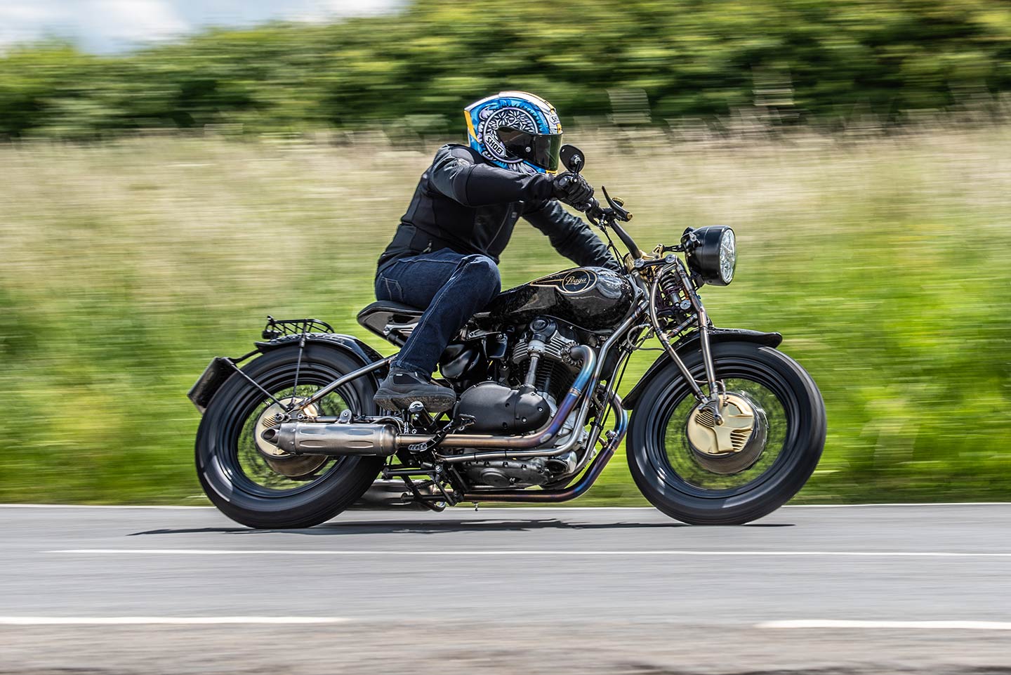 Carbon fiber, a girder fork, no rear suspension, a Kawasaki engine, and drum brakes: It all comes together beautifully in the Praga ZS 800.