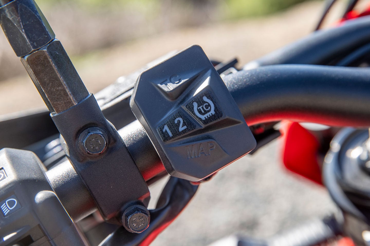Located on the left side of the handlebar is a map switch for traction control and ride modes. A button near the dash disables ABS.