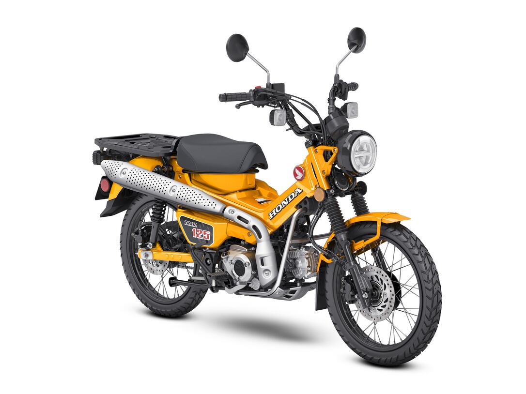 2024 Honda Trail125 in Turmeric Yellow.