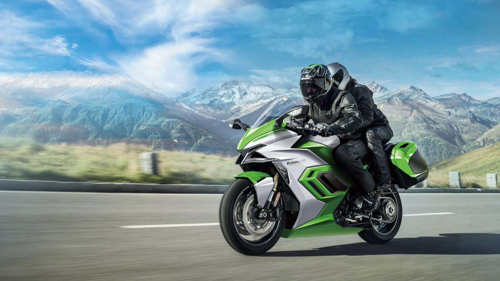 The original design sketch shows a much less cumbersome motorcycle, while the reality shows how much space the hydrogen tanks take up.