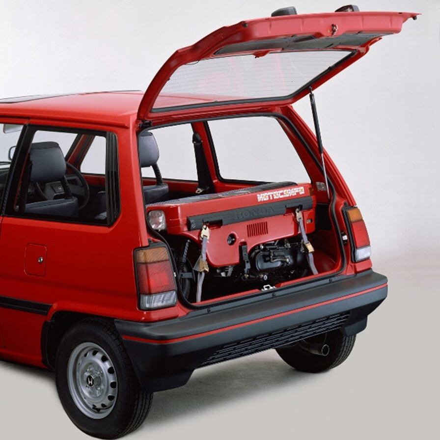 The Motocompo snugly fit into the trunk of the Honda City compact car