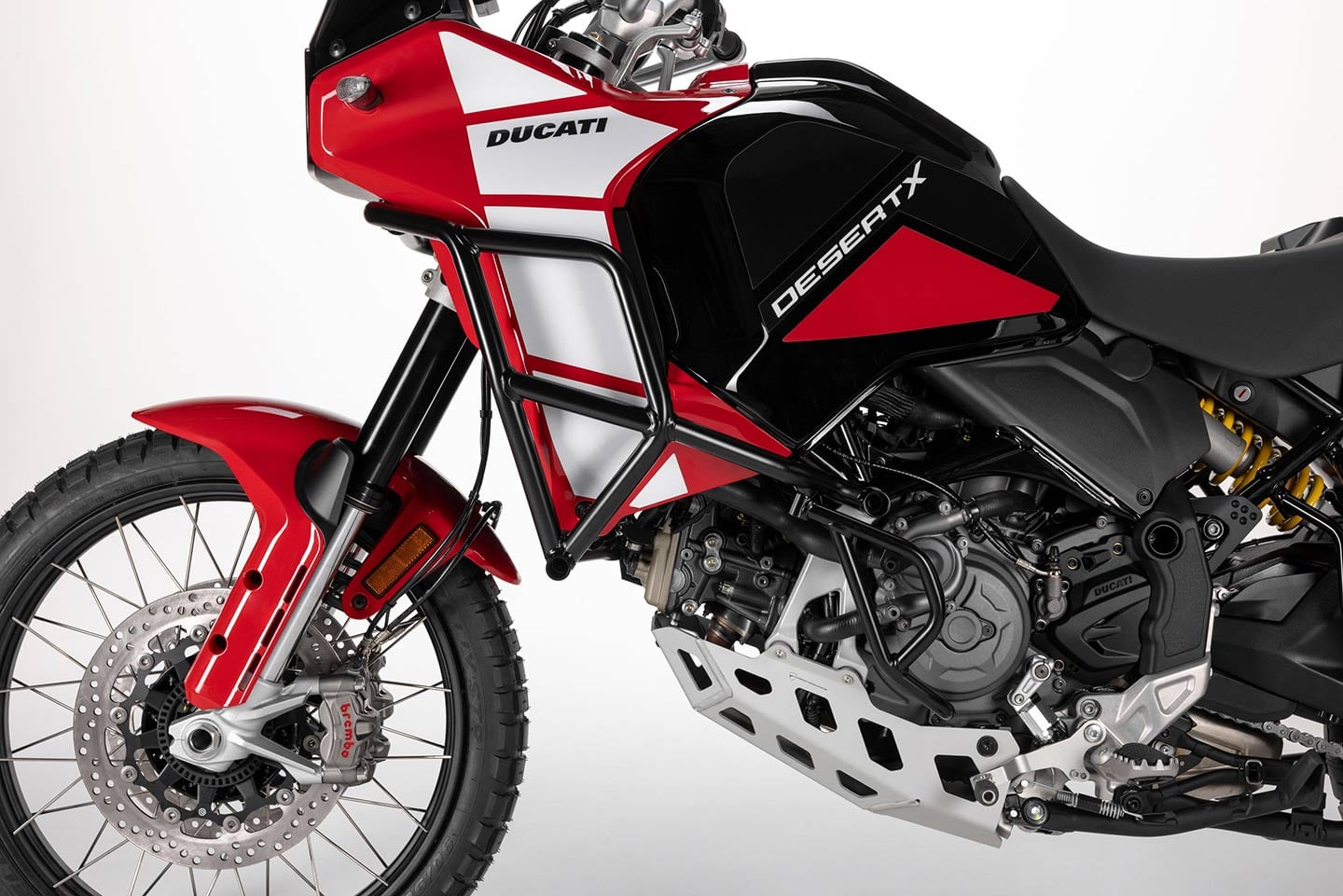 You get the same 937cc Testastretta engine as the other DesertX models, but standard equipment on the new Discovery includes radiator protection, engine guards, and even a centerstand.