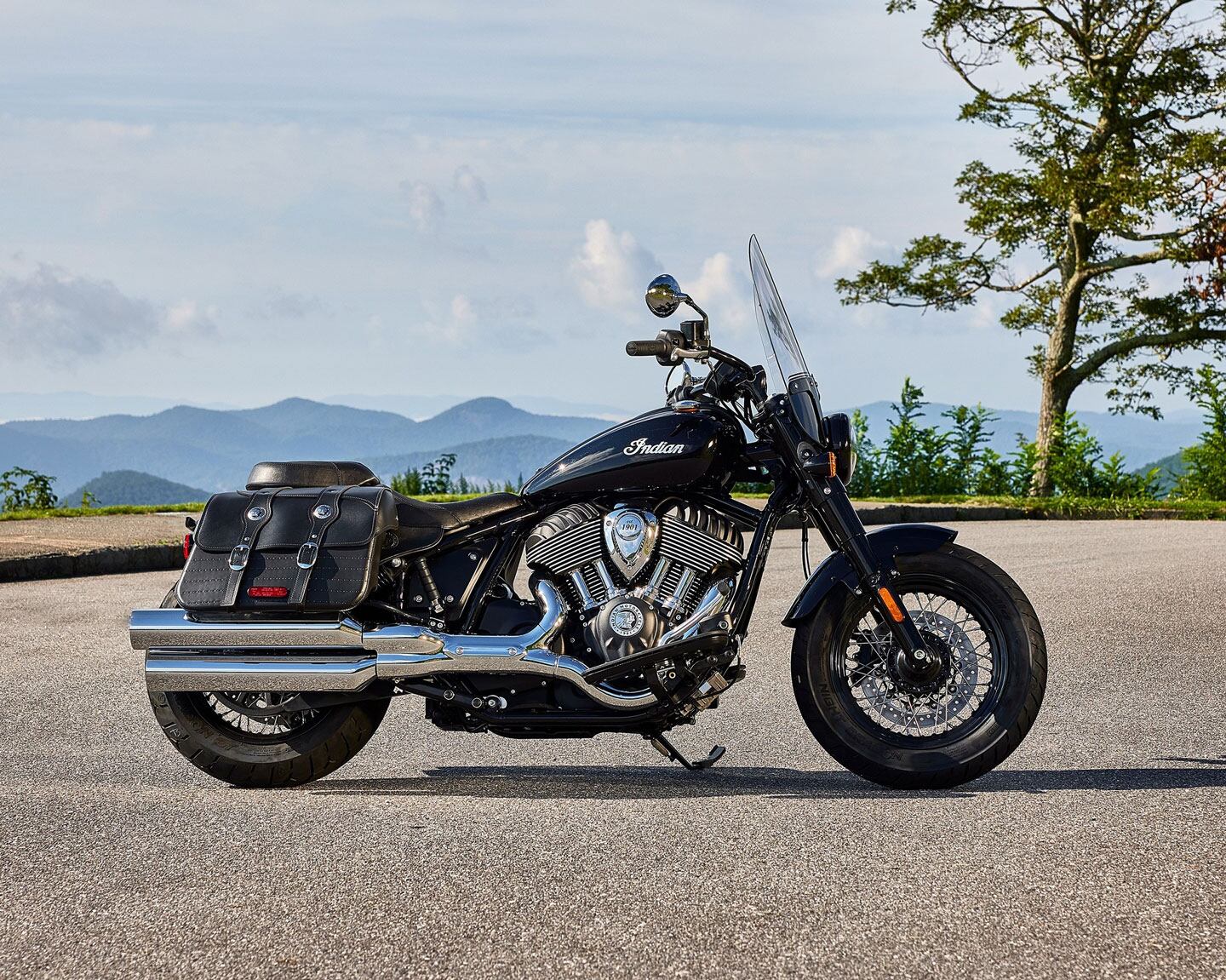 The Indian Super Chief adds saddlebags, floorboards, and a touring shield but keeps bodywork to a minimum for a classic cruiser profile.
