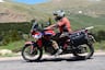 2024 Honda Africa Twin riding on road through Colorado Rockies