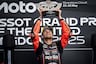 Marco Bezzecchi holds trophy at Silverstone MotoGP race