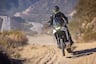 2025 Honda XL750 Transalp riding on dusty dirt road