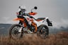 2025 KTM 390 Adventure R parked on dry grassy field