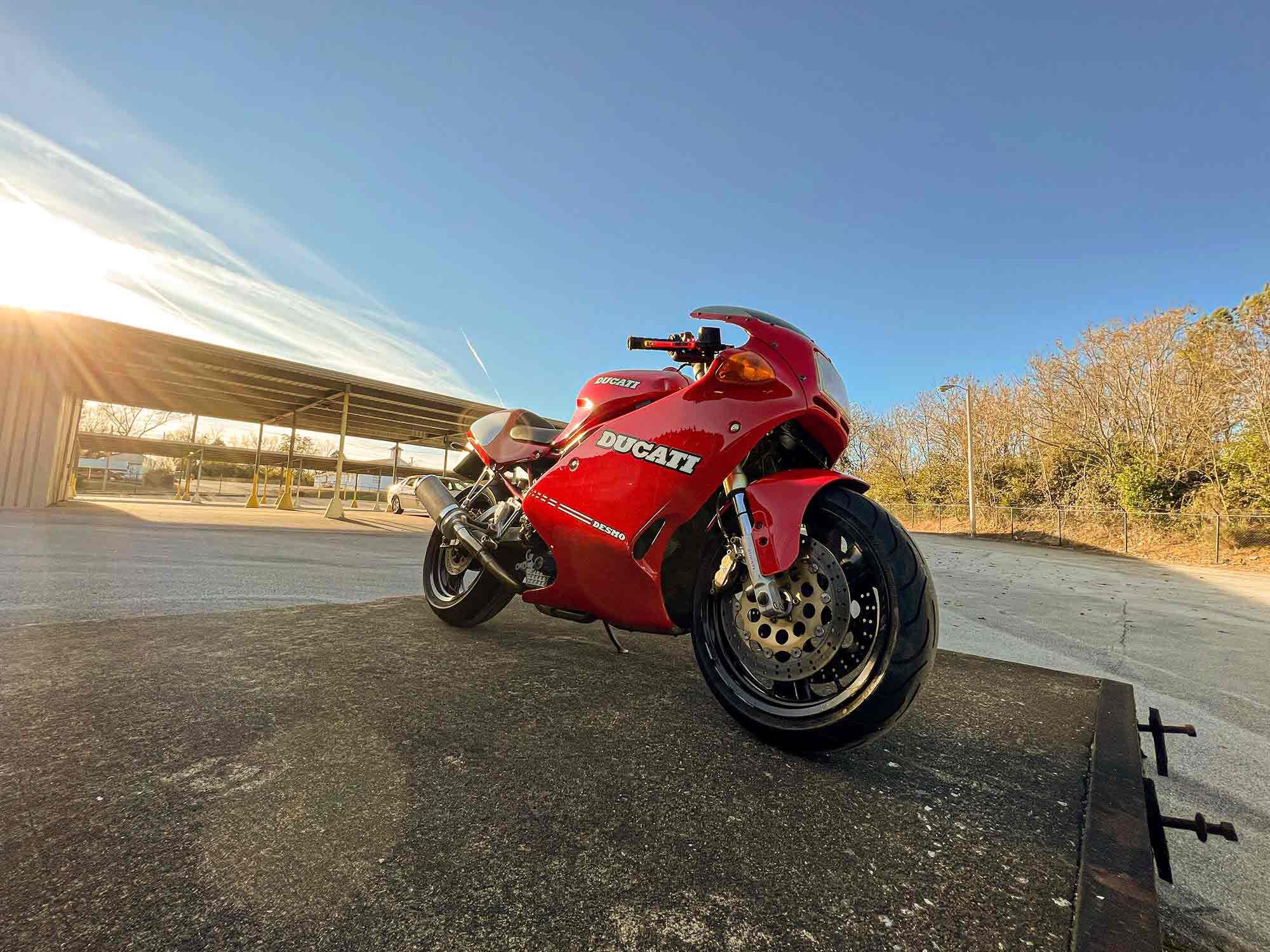 Blue skies and a red bike.