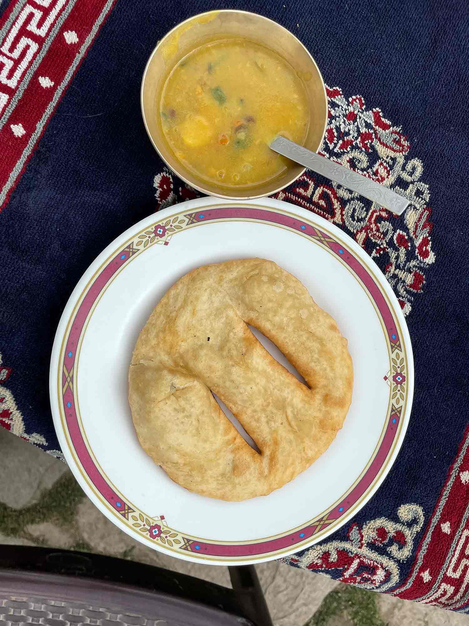 Typical breakfast of flatbread and soup.