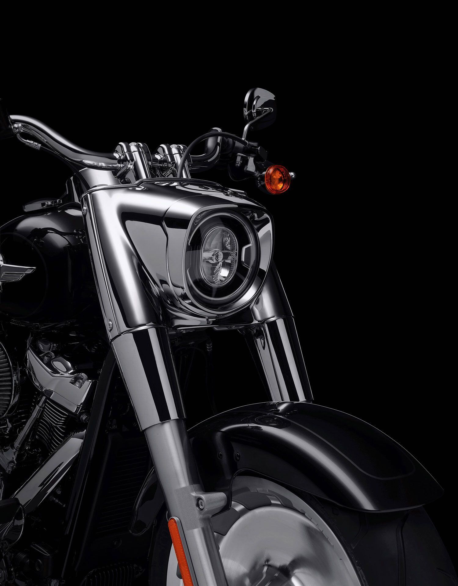The satin is out, the bright chrome is in, and it makes the Fat Boy’s signature headlight nacelle look even more imposing.
