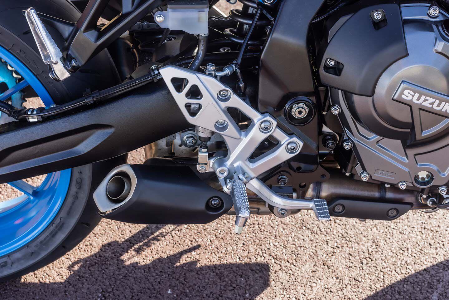 The stubby exhaust silencer exits out of the under-engine chamber that contains the catalytic converter.