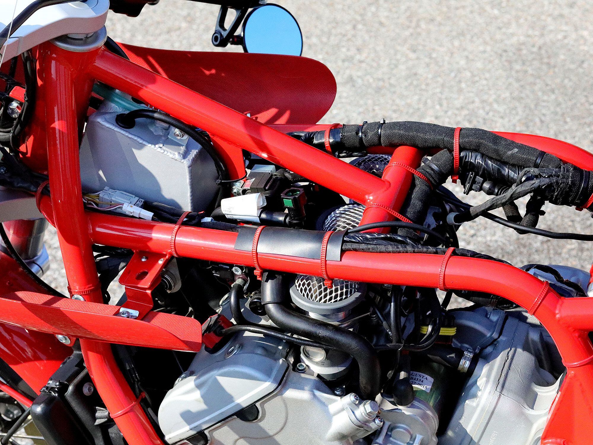 Beneath the Italia’s steel tube frame sits an MV Agusta 800cc triple fed through classically shaped velocity stacks.