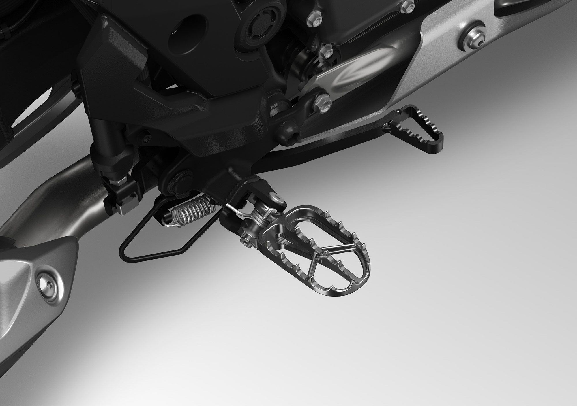 Footpegs are ready for off-road riding.