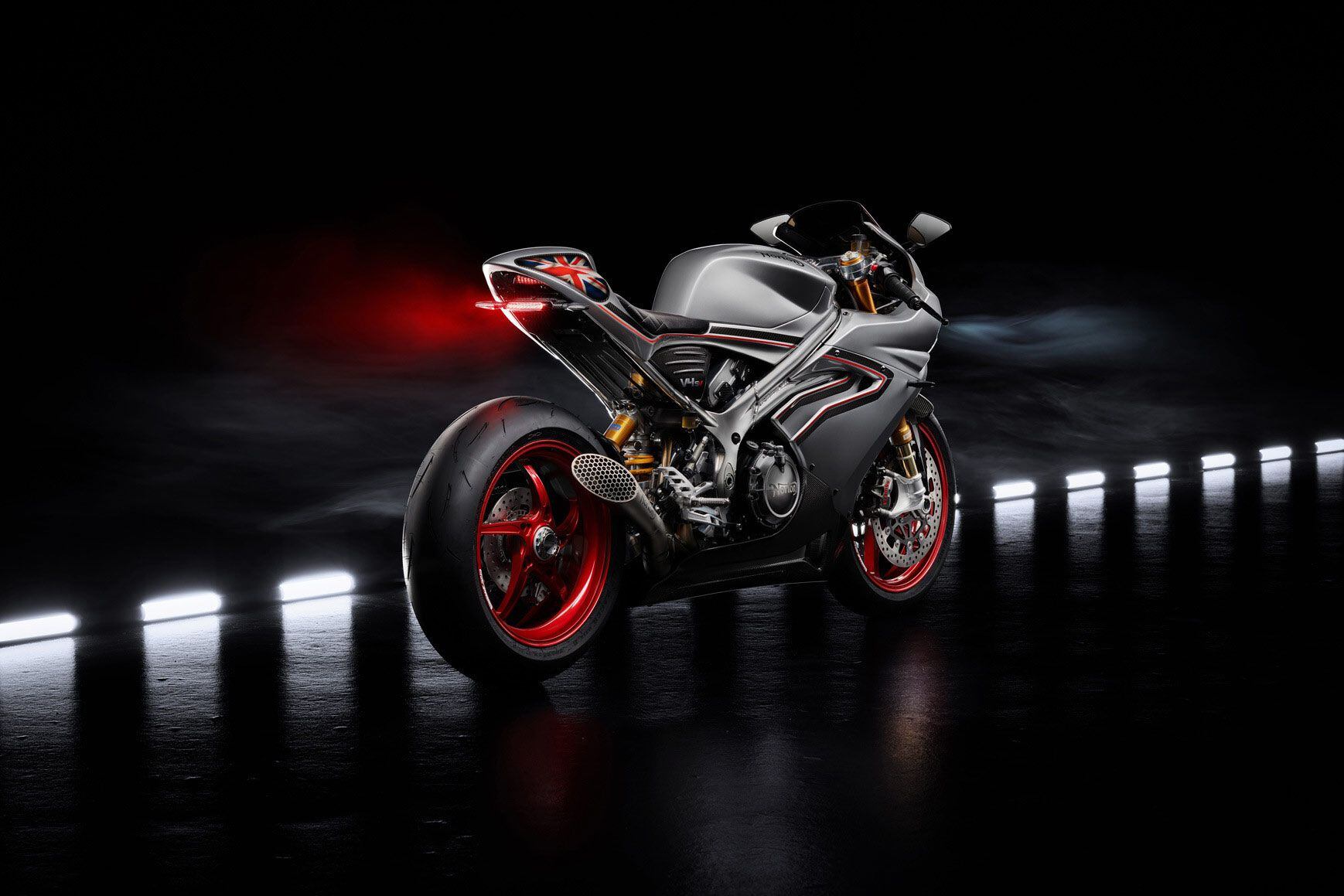 Electronics include a rearview camera and a quickshifter. The bike here is shown with a track-only exhaust unit, but consumer models will likely get bigger and quieter (and probably less attractive) pipes.