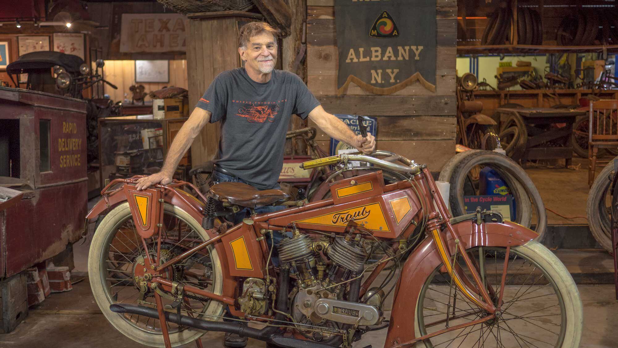 Dale Walksler with the 1916 Traub motorcycle found behind the wall of a building torn down in Chicago in 1967. Careful research has revealed that bike is a one-off machine completely custom built by one Reichard Traub, who designed and built/cast/machined every part of the motorcycle except for the seat, carburetor, magneto, and wheels. The craftsmanship is remarkable; even more incredible is that in 1916 Traub had built an 80ci engine some 20 years before Harley and Indian. It is unknown why Traub hid the bike and why he never sought to mass-produce the machine.