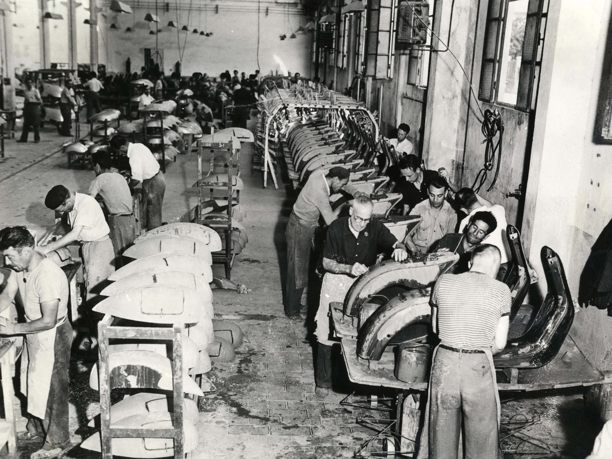In the beginning, the Vespa factory (shown here in 1947) was pretty basic. Today, many readers have home garages that are better equipped!