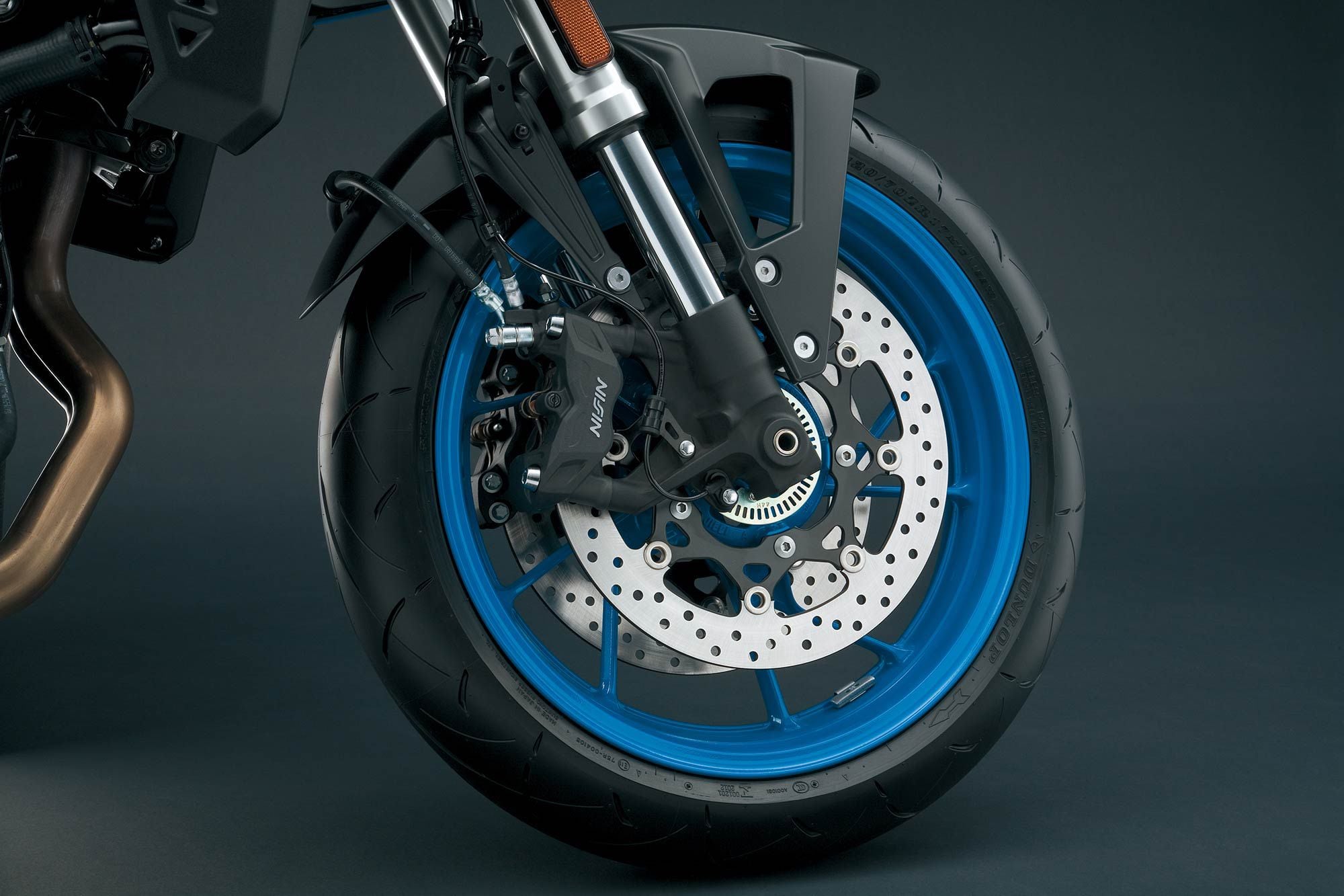 Up front is an inverted KYB fork, and a pair of four-piston Nissin calipers.