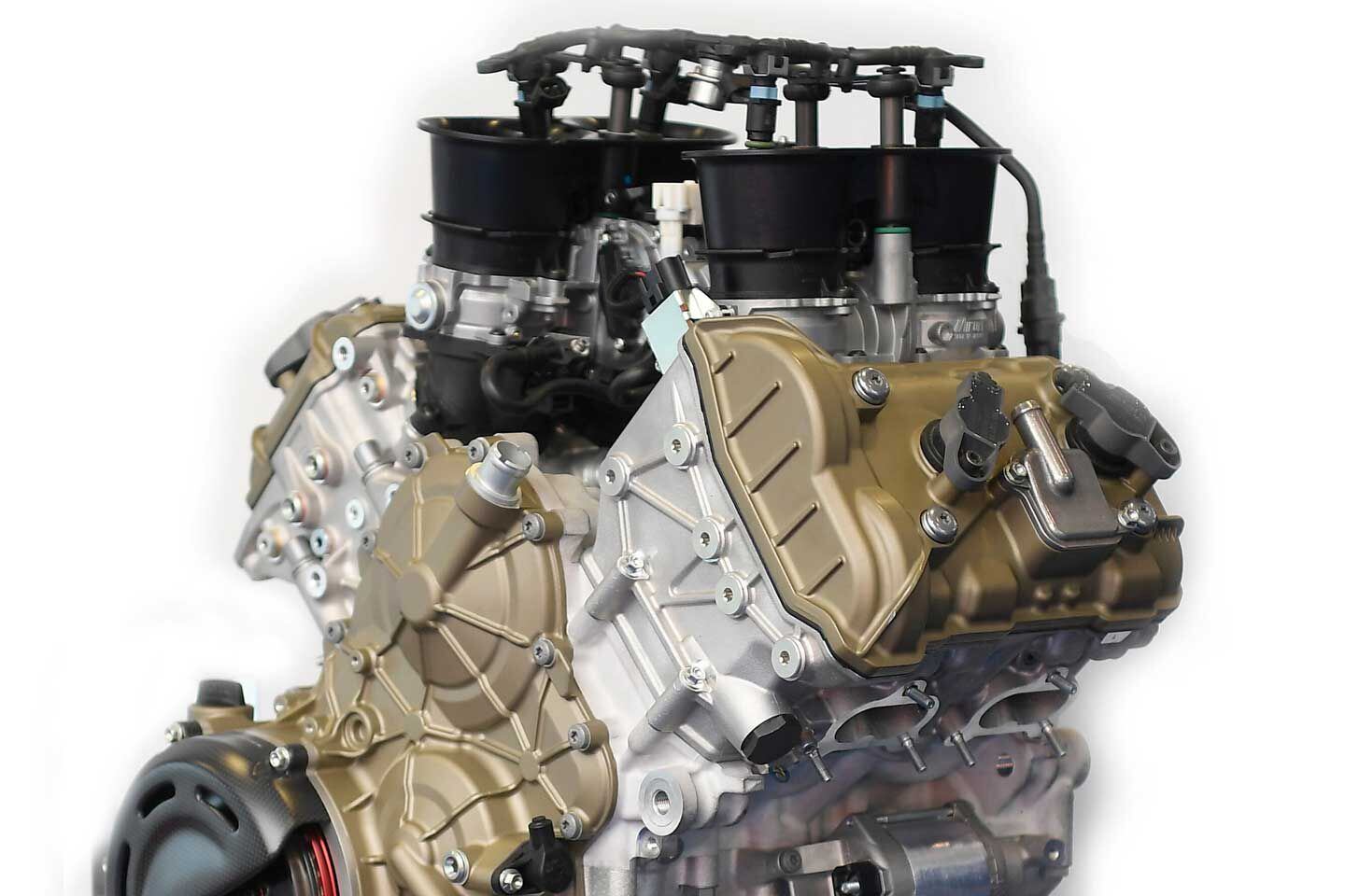 Included valve angles have decreased dramatically, and now a single less interesting cover houses the entire valve train.