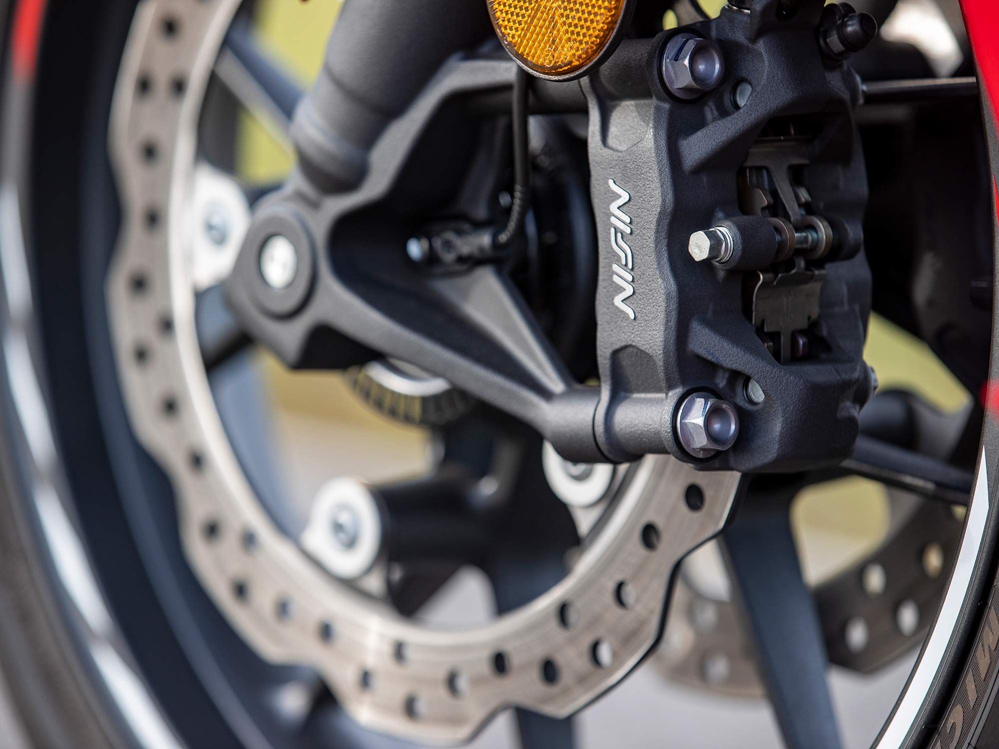 Upgrades to the Honda’s braking system included dual radial-mount four-piston Nissin calipers clamping to 296mm discs with ABS as standard equipment.
