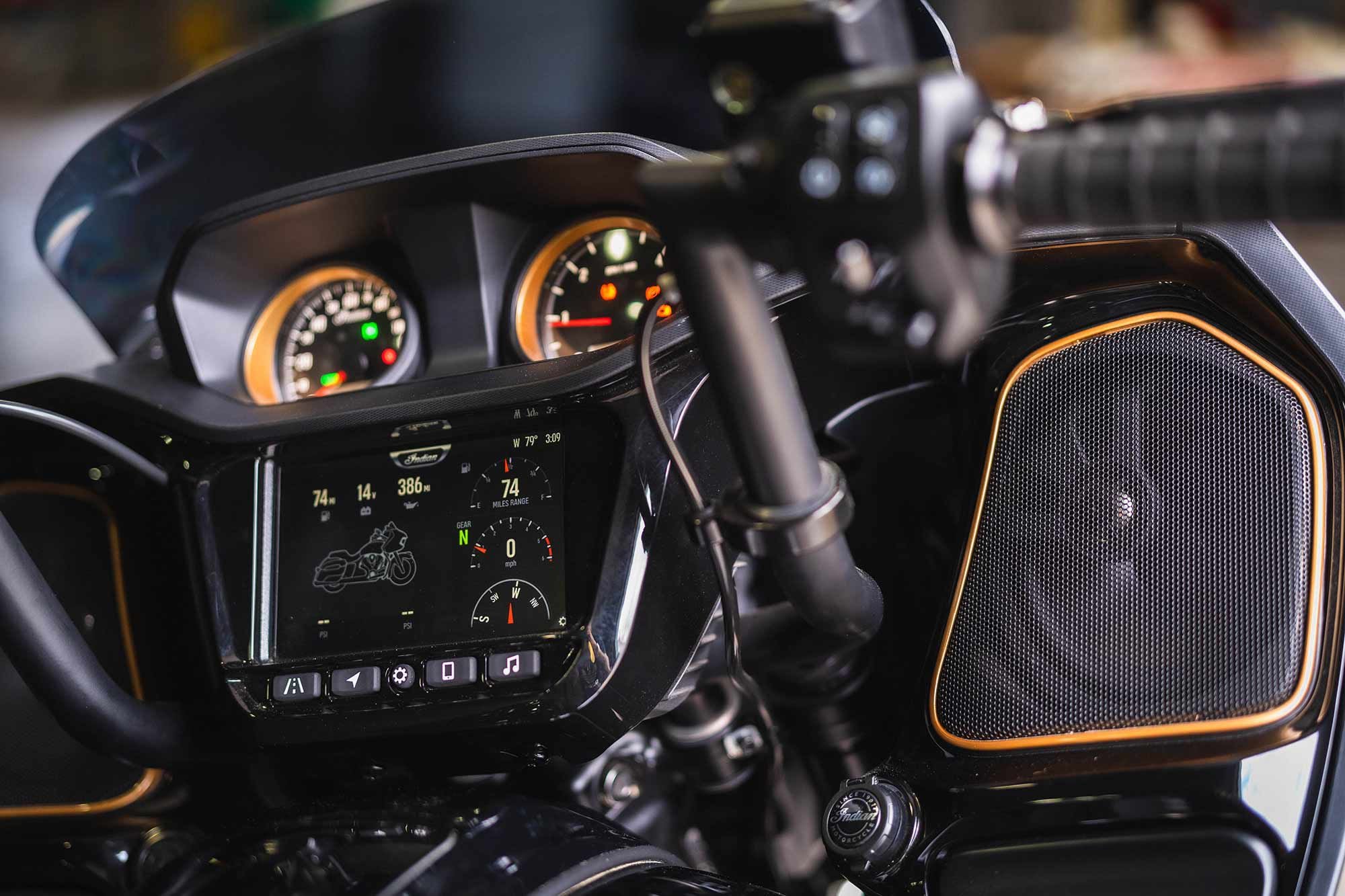 Bronze accents around the speakers and gauges add pops of color to keep things interesting.