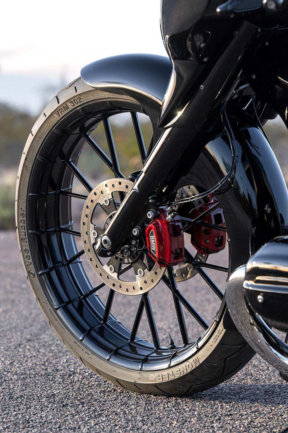 The new 26-inch front wheel cut from a 400-pound block of solid aluminum is covered by a 180mm-wide front tire. The frame had to be stretched and raked to accommodate it.