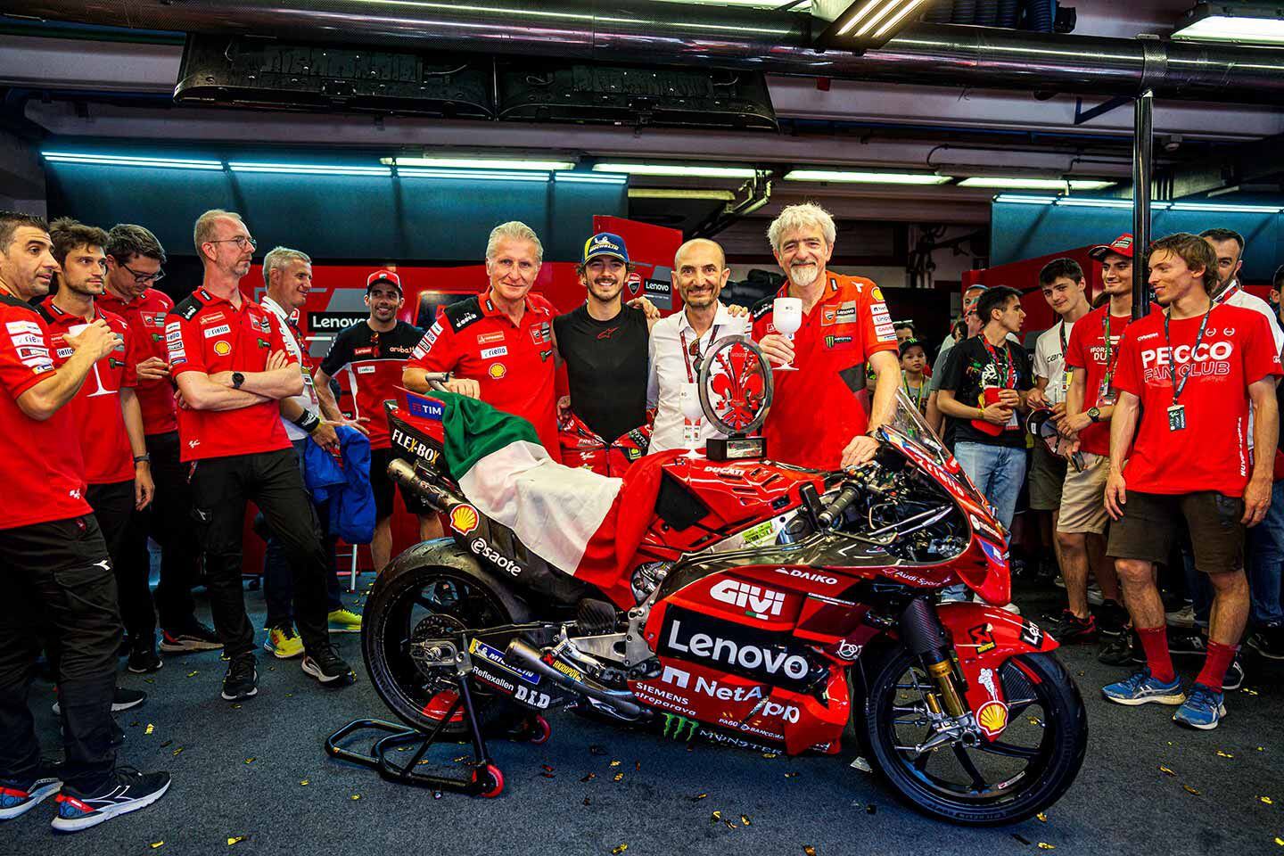 Celebrating the Mugello victory in the pit garage. Francesco Bagnaia is flanked by Ducati Sporting Director Paolo Ciabatti, CEO Claudio Domenicali, and Ducati Corse General Manager Gigi Dall’Igna.