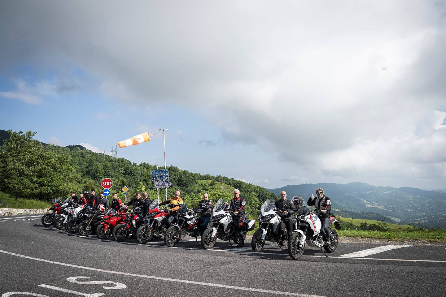 Raticosa, an intersection along the Futa Pass popular among bikers. Bologna is to the north and Florence to the south. On the far right, posing with the journalists, is Francesco Milicia, VP of global sales, who coincidentally rode through on his way to the race.