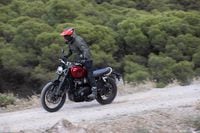 2024 Triumph Scrambler 1200 X riding on dirt road